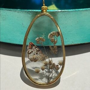 Gold Oval Pendant with Butterfly and Dried Flowers